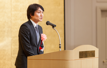 来賓祝辞（経済産業省 大臣官房 技術総括審議官谷明人氏）